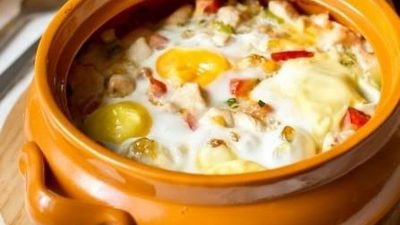 Запеченное филе с овощами под яйцами