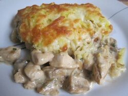 Курица, запечённая с грибами под картофелем