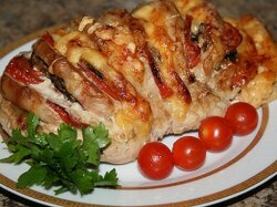 Мясо «Гармошка» с помидорами в духовке
