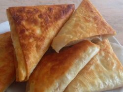 Быстрые пирожки из лаваша с сыром, ветчиной и зеленью